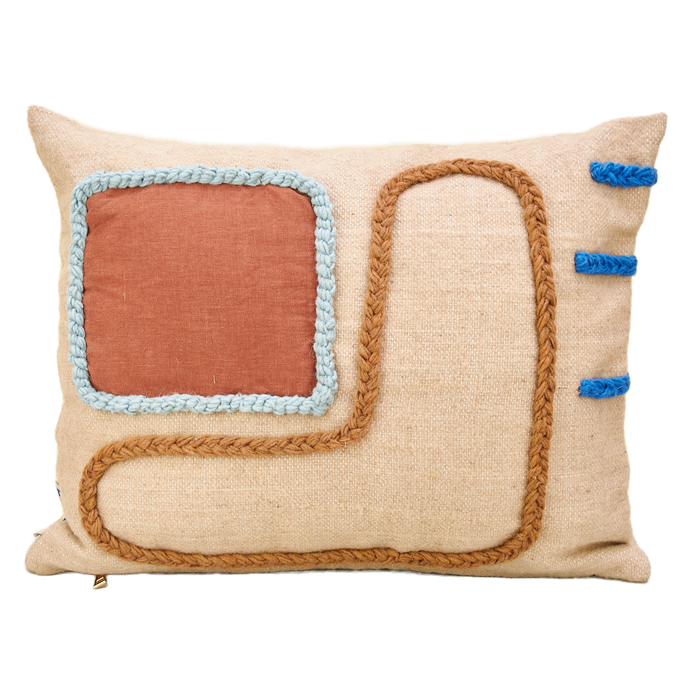 Handwoven wool cushion with cotton hand embroidery on a soft peachy/pink base, designed by LRNCE and made in Morocco. LRNCE is a Marrakesh-based lifestyle brand founded in 2013 by Belgian designer Laurence Leenaert. Comes with a cushion filling insert. Beige cushion with orange, brown and blue detailing. 