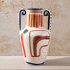 Decorative ceramic vase with abstract patterns on a beige background
