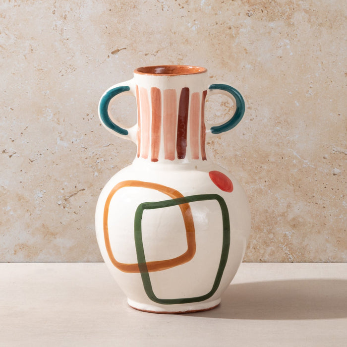 Ceramic vase with abstract design on a beige background