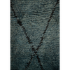 Close-up of a Moroccan Berber textured blue rug with a simple black diamond design