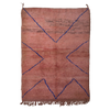 Rust-coloured peachy pink Moroccan Berber rug with a simple linear design in cobalt blue.