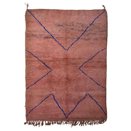 Rust-coloured peachy pink Moroccan Berber rug with a simple linear design in cobalt blue.