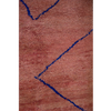 Peachy pink Moroccan Berber rug with a simple linear design in cobalt blue.