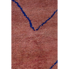 Peachy pink Moroccan Berber rug with a simple linear design in cobalt blue.
