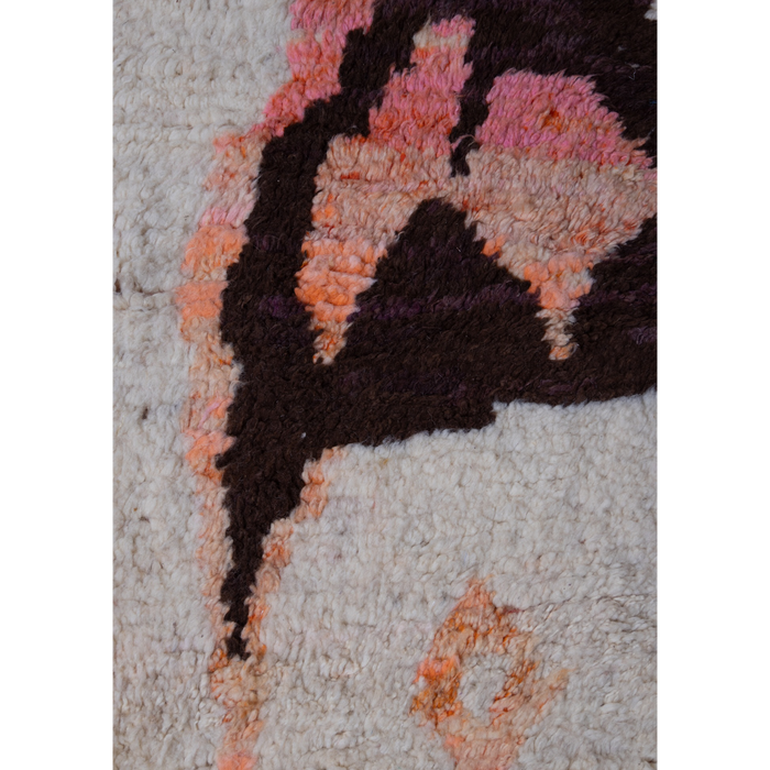 Moroccan Berber Boujad wool hand-knotted rug with abstract design in cream, pink and orange with brown.