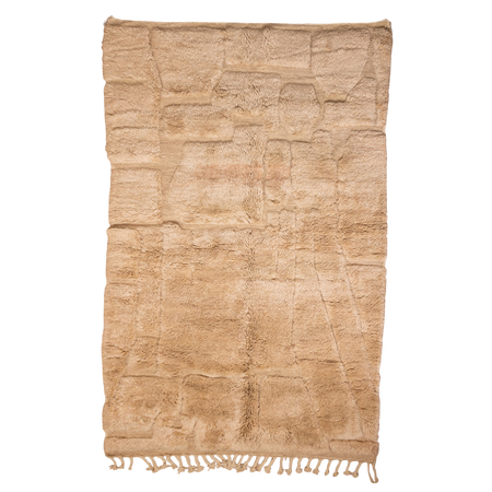 Beige textured rug with fringes on a white background