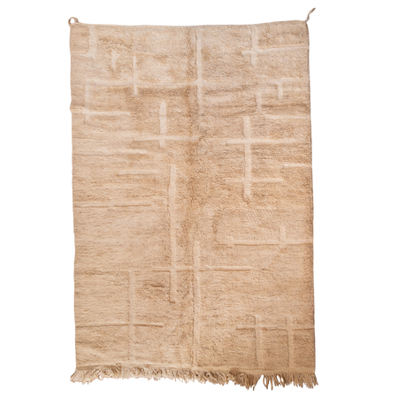 Beige hand-knotted rug with a geometric pattern on a white background