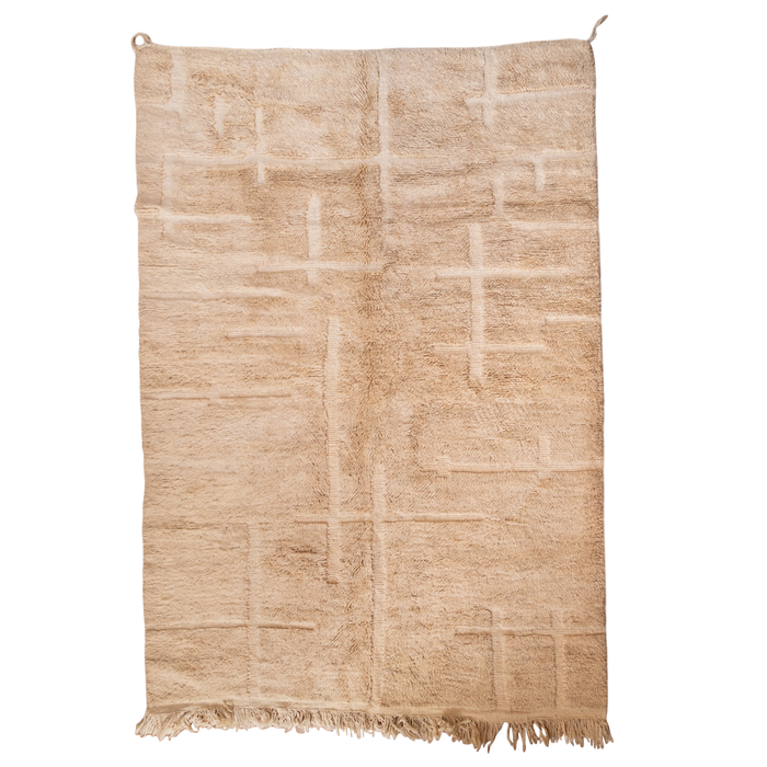 Beige hand-knotted rug with a geometric pattern on a white background