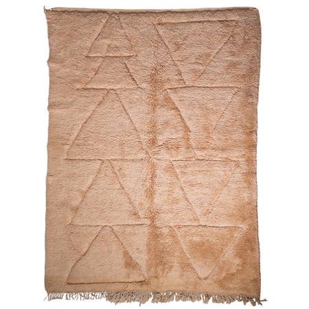 Pale pink rug with geometric triangle pattern on a white background