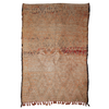 Moroccan hand knotted rug with intricate patterns and fringes on a white background