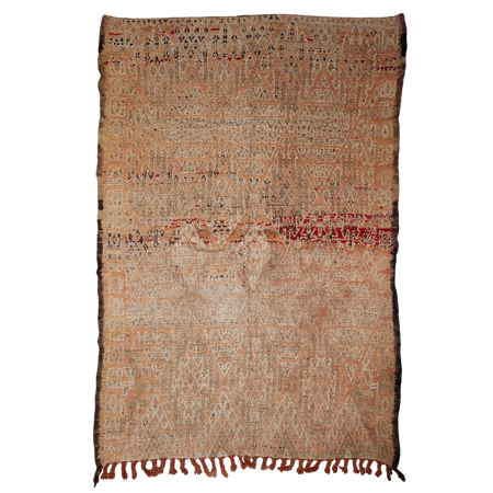 Moroccan hand knotted rug with intricate patterns and fringes on a white background