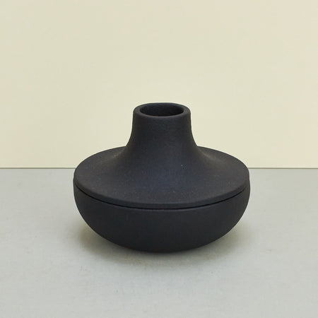 Black cast iron candle holder