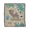 Woven art blanket mini featuring a figure at rest on a patio among tropical foliage by BFGF