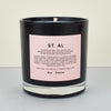 black candle with pink label. 