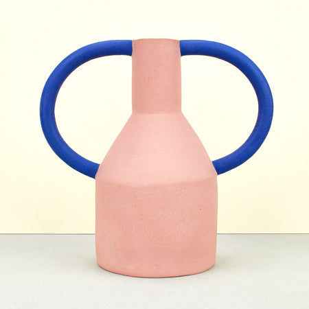 Matte pink vases with cobalt blue internal glaze. blue handles