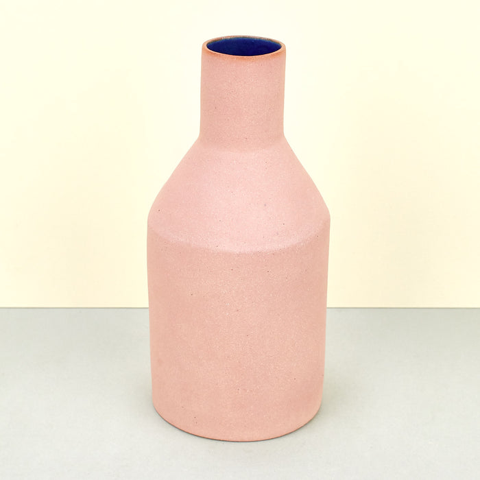 Matte pink vases with cobalt blue internal glaze