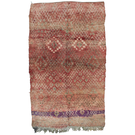 Moroccan vintage berber boujad rug has a warm red and pink toned base with an intricate design in brown, grey and cream with a stripe of purple