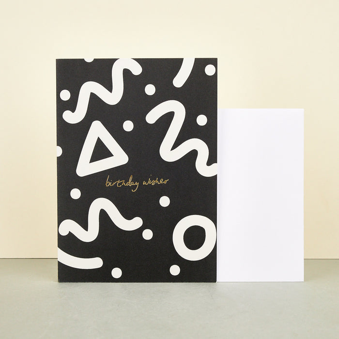 'Birthday Wishes' Card by Kinshipped. Black background with white squiggly lines and reading birthday wishes cursive.