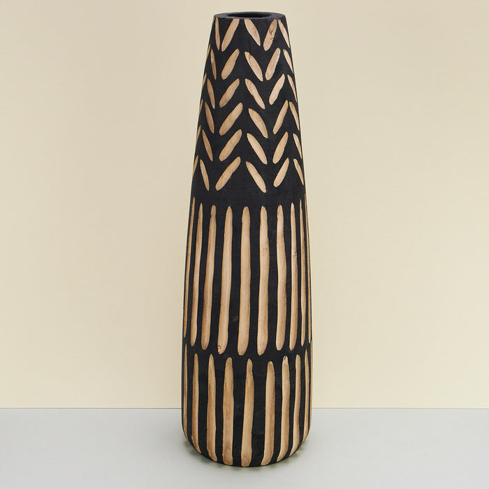 hand-carved floor vase made of paulownia wood. black vase with carved out patterns