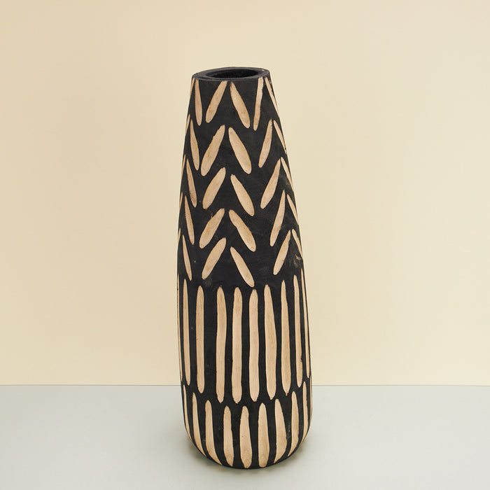 hand-carved floor vase made of paulownia wood. black vase with carved out patterns