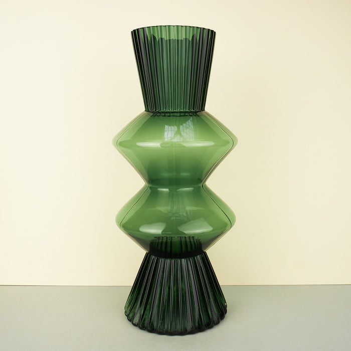 Sculptural-shaped ribbed glass vases in green dyed glass