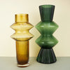 Sculptural-shaped ribbed glass vases in mustard and green dyed glass
