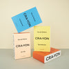 cra-yon colourful perfume bottle boxes stacked on a plain background