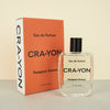 perfume bottle next to orange perfume box CRA-YON