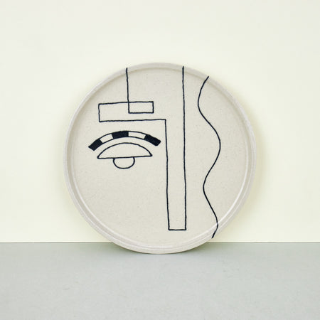 ceramic plates with abstract faces. 