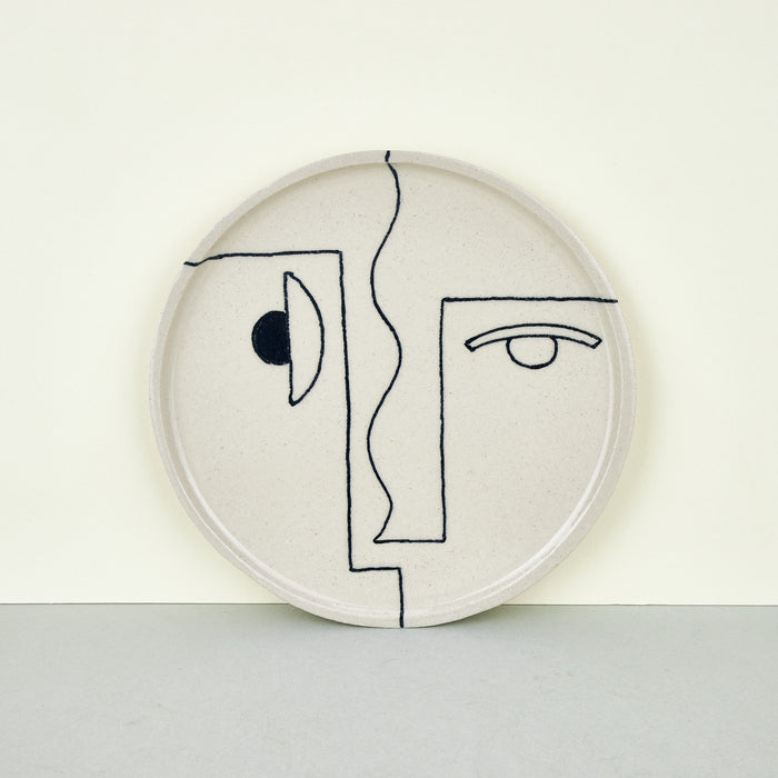 ceramic plates with abstract faces. 