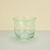 green glass on a plain background. 