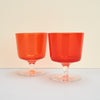Ichendorf Milano 'Aurora' Orange Stem Glass, two glasses on a plain background. 