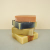 natural coloured soap stacked on a plain background
