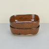 ceramic shallow plates and deeper dishes brown
