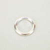 'Brook' Ring by the Nagle & Sisters. Silver ring band on a plain background. 