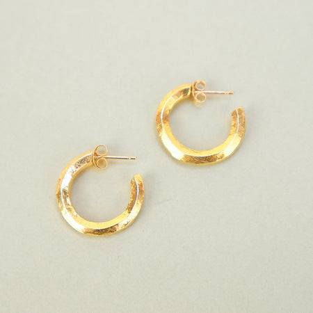  'Brook' stud chunky hoops carved hoop 100% solid gold earrings by Nagle & Sisters. gold hoops on a plain bbackground. 