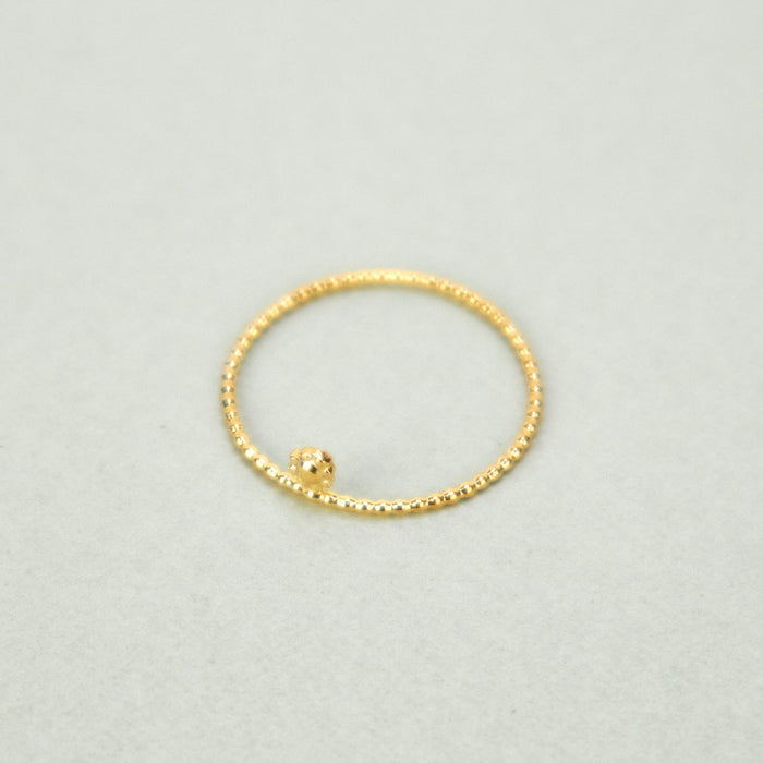 'Flora' Micro Ring by Nagle & Sisters 18ct gold plated silver. thin ring on plain background.