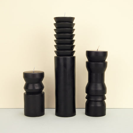 Sculptural totem-inspired candles in black-coloured wax