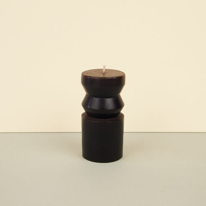 Sculptural totem-inspired candles in black-coloured wax