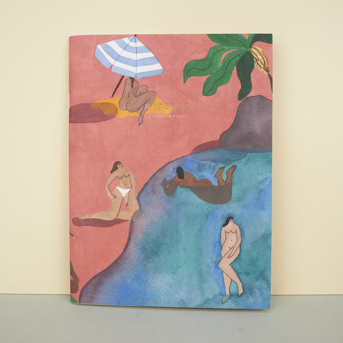 notebook of illustration featuring a beach and nude women. 